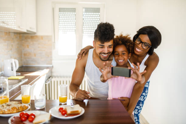 istock Cheerful family taking Selfie during breakfast 1059617216