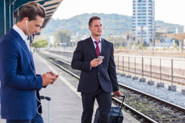 istock Young businessmen with suitcases 1059617262
