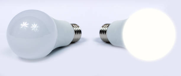 istock LED bulbs isolated on white background, one of the bulbs lit 1059617614