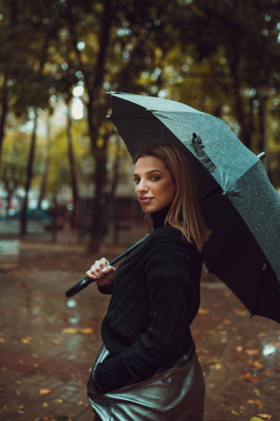 istock Stylish woman with umbrella 1059617786