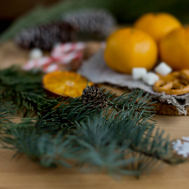 istock Christmas still life with tangerines and fir tree 1059619458