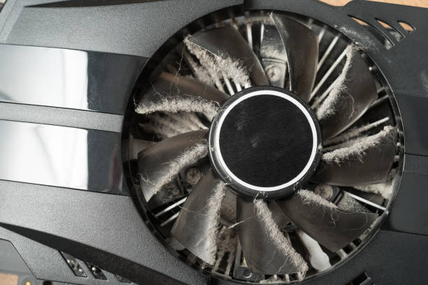 istock Closeup of dusty computer graphics card fan. 1059620088