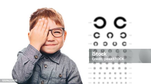 Little Boy Having Eye Exam With Eye Chart Stock Photo - Download Image Now - Child, Eyeglasses, Boys