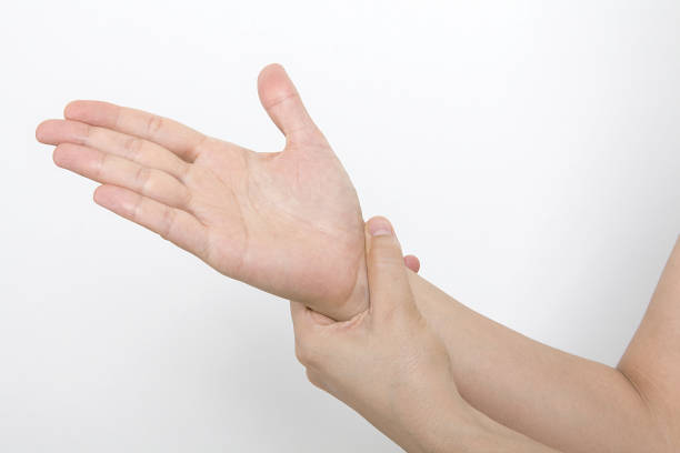 istock Woman holding her wrist. Pain concept. 1059624982