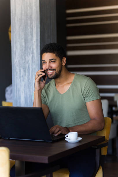 istock Young influencer and blogger having a phone call in a cafe 1059625394