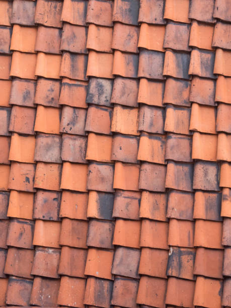 istock Red roof tiles to use as background 1059627020