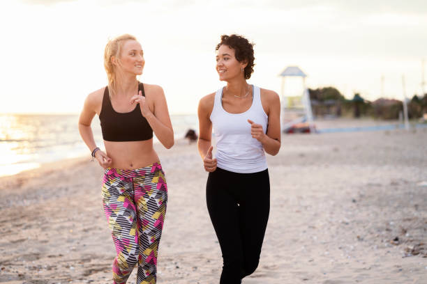 istock Girls jogging together 1059629666