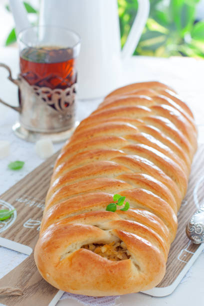 istock Kulebyaka with cabbage, traditional pie in Russian cuisine, selective focus 1059629980