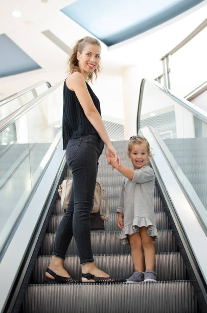 istock Young mother shopping with little daughter 1059630108