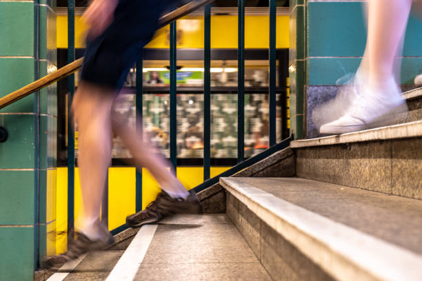 istock Low Section Of Man Walking On Staircase 1059632260