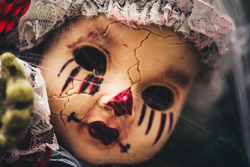 Head of beautiful scary doll like from horror movie