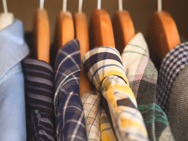 istock Man's closet hangers shirts closeup 1059633050