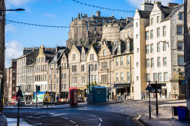 istock Square Lined with Colourful Shops and Historic Buildings in Edinburgh, UK 1059633098