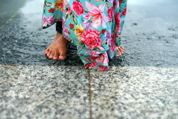 istock Water fun. kids splashing water with barefoot 1059634804