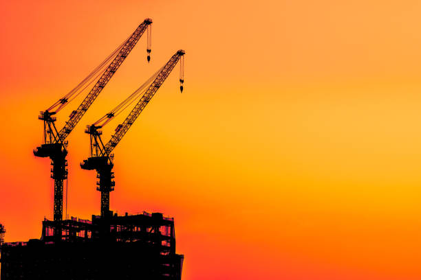 The building site is in the evening, Tower cranes build residential buildings
