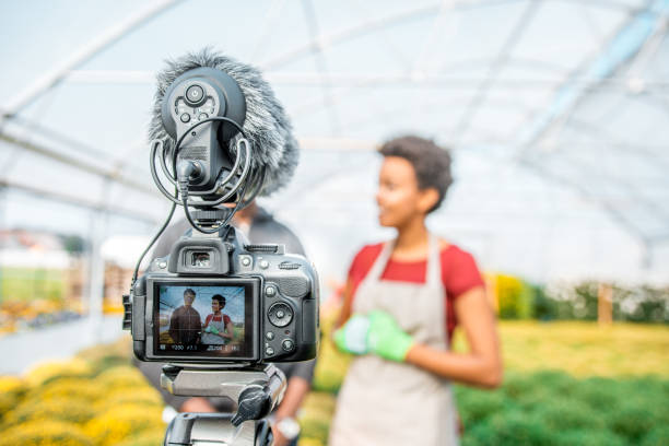 istock Two African people vlogging in a greenhouse 1059637112