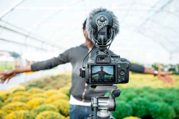 istock African American man vlogging in the greenhouse 1059637120