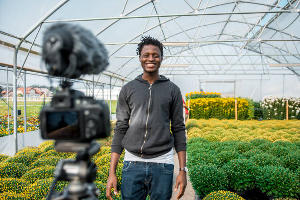 istock African American man vlogging in the greenhouse 1059637126