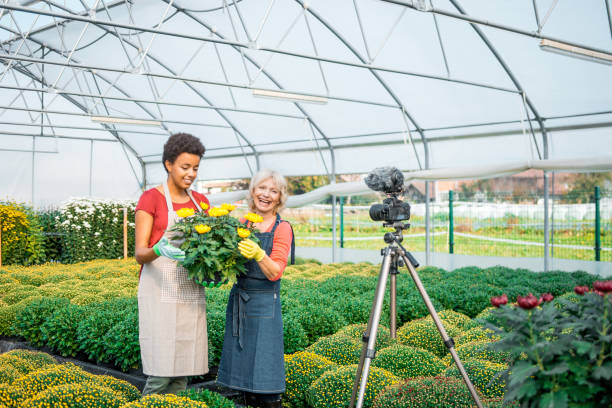 istock Two women vlogggin in a greenhouse 1059637178