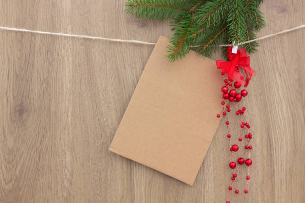 istock Christmas template-empty blank and tree branches on wooden background  with decoration 1059637202