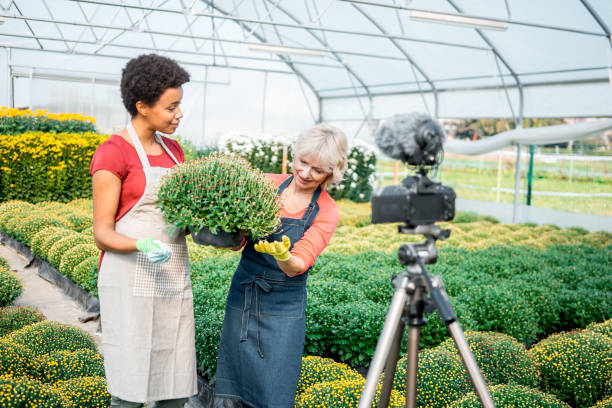 istock Two women vlogggin in a greenhouse 1059637206