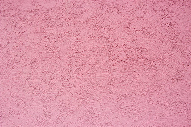 Plaster on the wall.Pink abstract grunge texture
