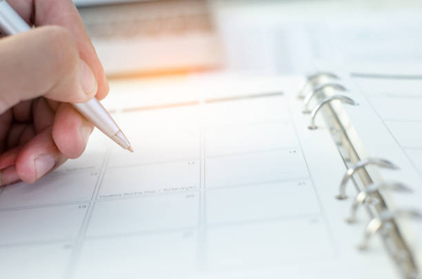 istock Cropped Hand Writing On Calendar 1059639798