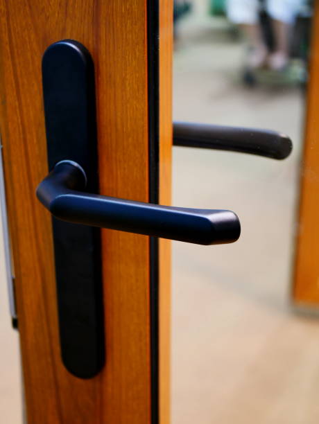 istock Metal door handle with key on door 1059644590