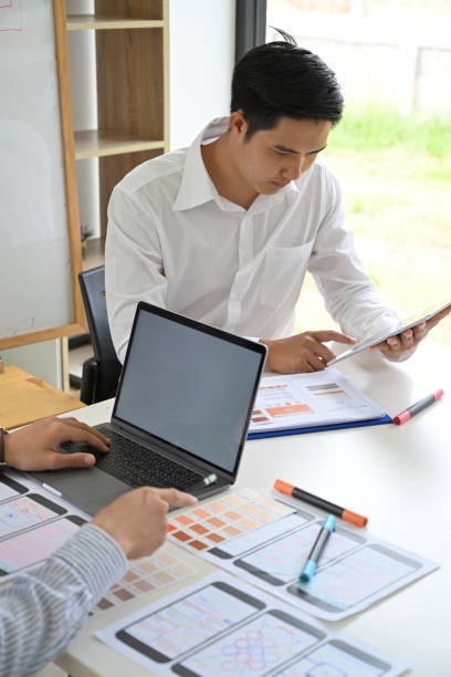 istock Web designer teamwork concept UX UI designer planning layout application for mobile phone mockup 1059644774