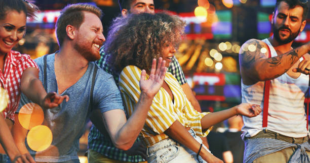 istock Friends dancing at a concert. 1059646174