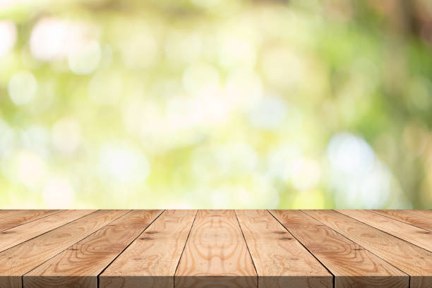 istock Empty wood table on blurred background copy space for montage your product or design,Blank brown board with abstract blurred background 1059647678