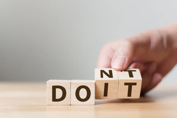 istock Hand flip wooden cube block with word don’t change to do it. Personal development and career growth or change yourself concept 1059649140