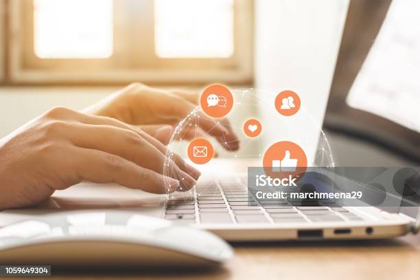 Hand Of Businessman Using Laptop With Icon Social Media And Social Network Online Marketing Concept Stock Photo - Download Image Now