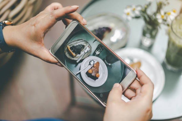 istock Cropped Hands Photographing Cakes On Table 1059653662