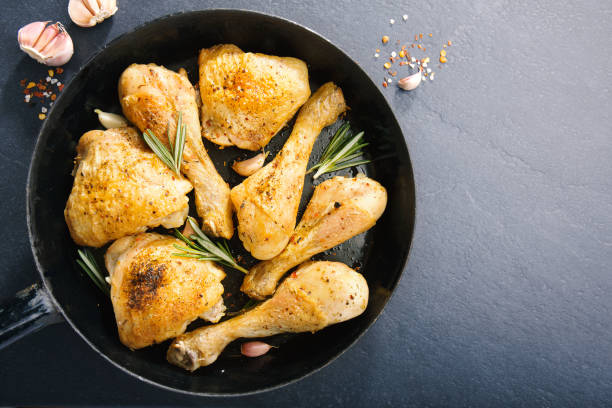 istock Tasty baked chicken legs with spices 1059654684