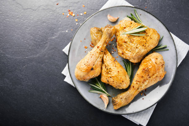istock Tasty baked chicken legs with spices 1059654738
