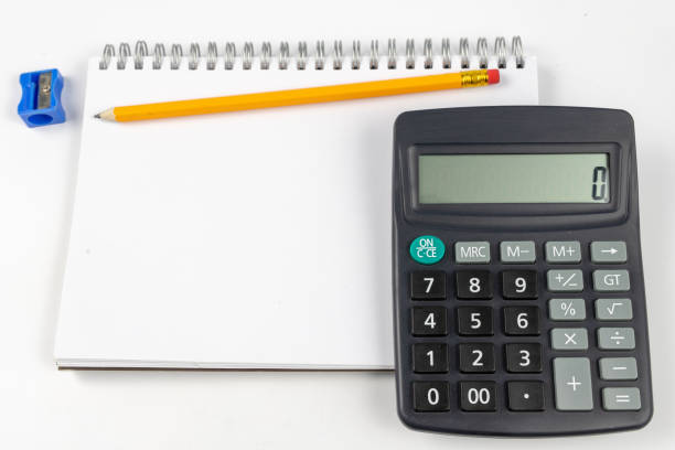 istock Notebook for taking notes and pencil on the office table. Accessories for quotation and memorization needed in accounting. White background. 1059658464
