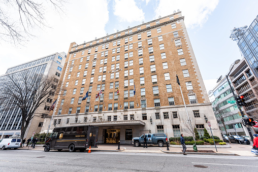 Washington DC, USA - March 9, 2018: Mayflower hotel building in capital city, UPS delivery truck, exterior, wide angle perspective
