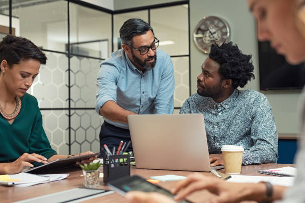 business people working in a meeting room - business casual ethnic multi ethnic group imagens e fotografias de stock