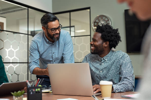 istock Happy business team in a meeting 1059661384