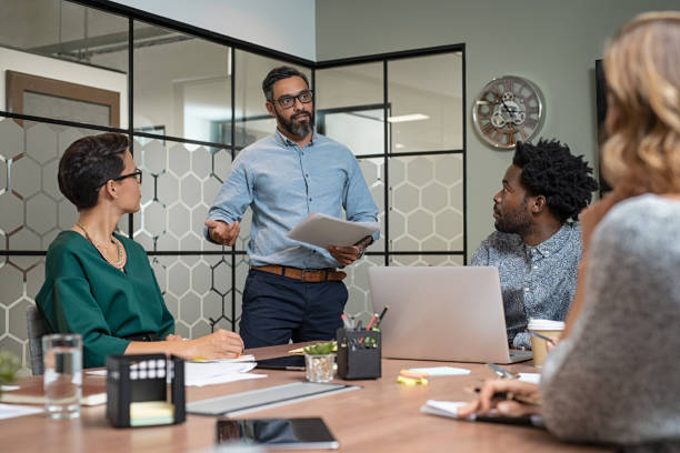 Man giving presentation in boardroom
