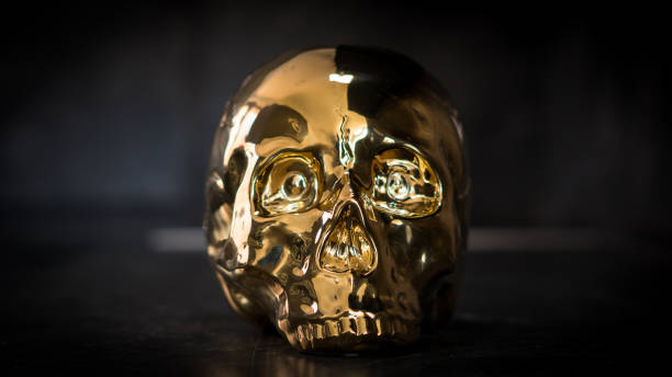 istock Golden Skull Metalic in black background 1059661878
