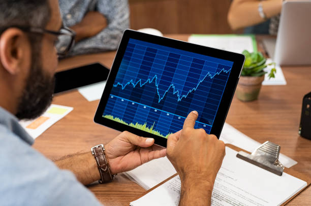 istock Business man reading stock market graph 1059661908