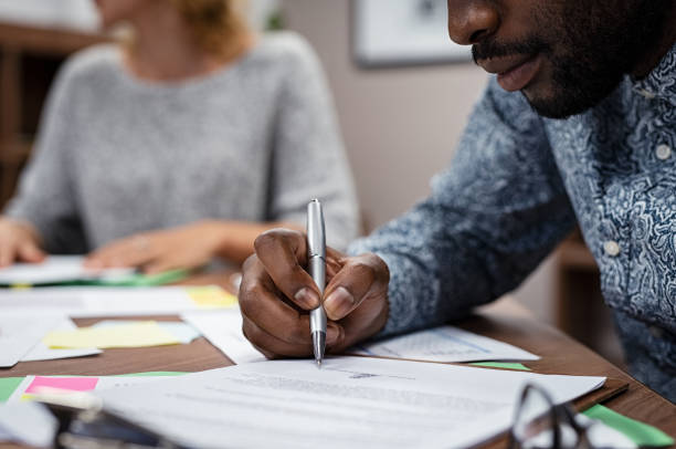 istock Casual buainessman signing contract 1059662352