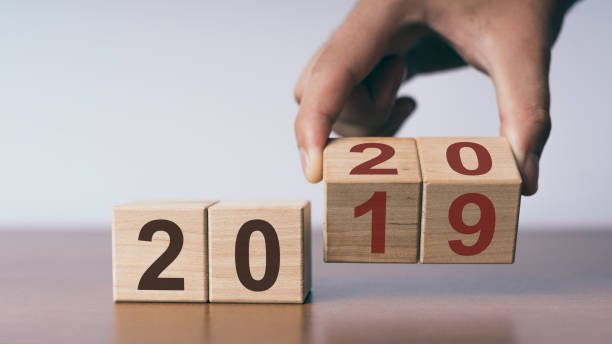 istock New year 2019 change to 2020 concept, hand change wooden cubes 1059664412