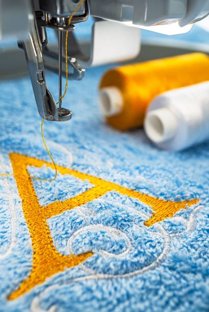 istock Embroidery machine and alphabet logo on towel 1059669638