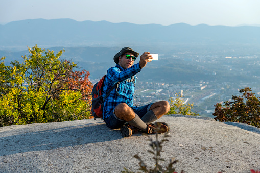 Hiker  Taking Selfie on the top of the hill, Julian Alps, Italy, Europe,Nikon D850