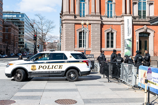 Washington DC, USA - March 9, 2018: Pennsylvania avenue during day in winter on national mall, Secret Service police car with security officers