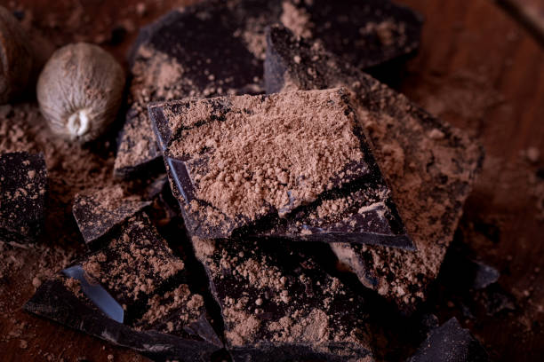 istock Dark chocolate bar crushed and sprinkled with cocoa powder with spices 1059676068