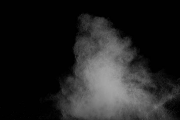 istock Bizarre forms of white powder explosion cloud against black background.White dust particles splash. 1059676436